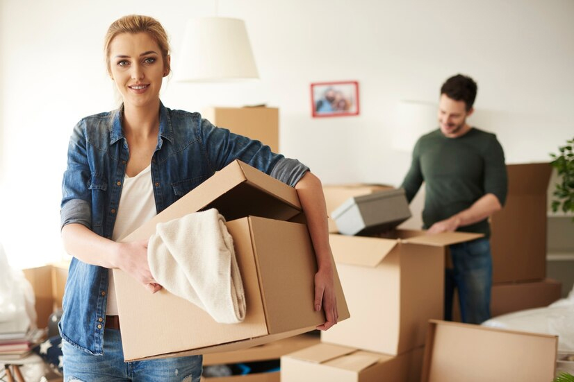  A person packing boxes.